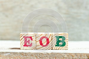Alphabet block in word EOB Abbreviation of end of business on wood background