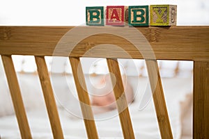 Alphabet blocks on baby bed