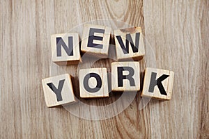 Alphabet blocks letters New York on wood background