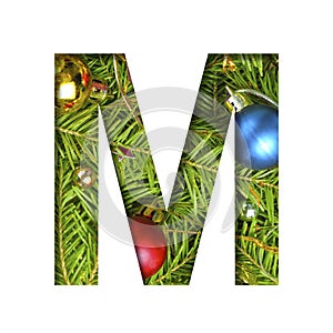 Alphabet on Christmas tree. The letter M cut out of paper on a background fresh ï¿½hristmas tree with colored balls. Set of