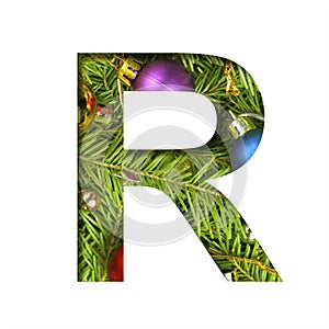 Alphabet on Christmas tree. The letter R cut out of paper on a background fresh ï¿½hristmas tree with colored balls. Set of