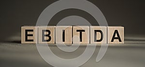 Alphabet letter block in word EBITDA is an abbreviation of earnings before interest, taxes, depreciation and amortization
