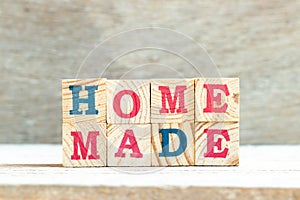 Alphabet in word homemade on wood background photo