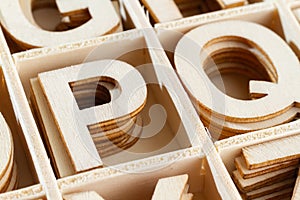 Alphabet letters in wooden box, top view