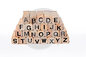 Alphabet letters on wooden cubes,a-z, abc, isolated on white