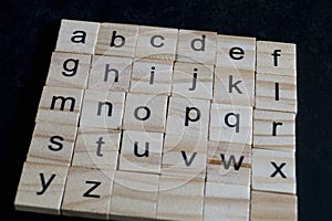 Alphabet letters on wooden scrabble pieces