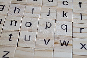 Alphabet letters on wooden scrabble pieces