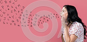 Alphabet letters with young woman speaking photo