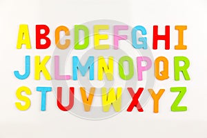 Alphabet magnets on whiteboard