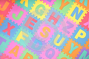 Alphabet puzzle letter tiles background