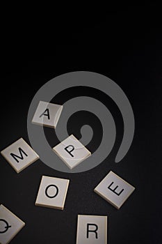 Alphabet in random order on a black background photo
