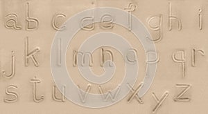 Alphabet from sand.