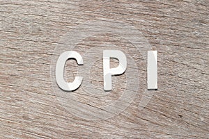 Alphabet in word CPI abbreviation of Consumer Price Index on wood background