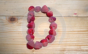 Alphabetical letter made of raspberries