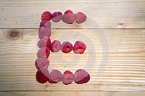 Alphabetical letter made of raspberries