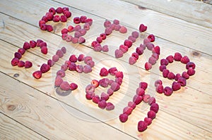 Alphabetical letters made of raspberries