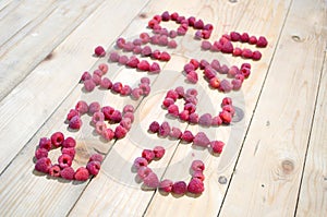 Alphabetical letters made of raspberries