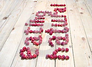 Alphabetical letters made of raspberries