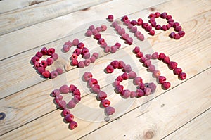 Alphabetical letters made of raspberries