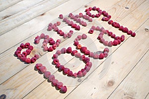 Alphabetical letters made of raspberries