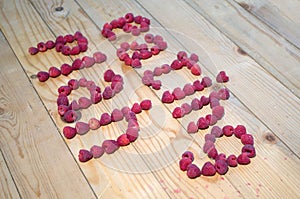 Alphabetical letters made of raspberries