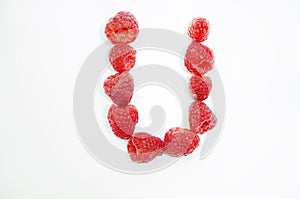 Alphabetical letters made of raspberries