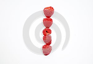 Alphabetical letters made of raspberries