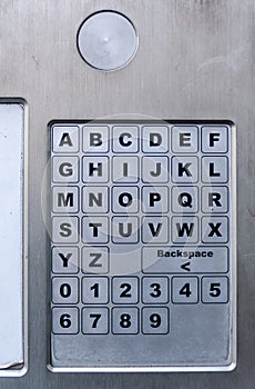 Alphabets and number touch keyboard from the automatic parking machine on the city pavement