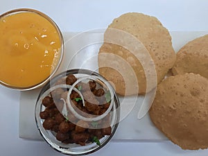 Alphonso Mango pulp with fried poori and channa