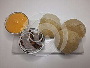 Alphonso Mango pulp with fried poori and channa