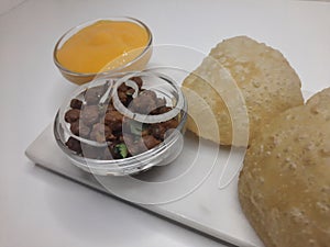 Alphonso Mango pulp with fried poori and channa