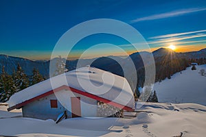 Alpin hut in the snow