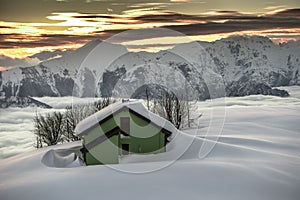 Alpin hut in the snow