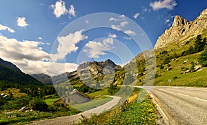 Alpin road with mountains ahead and beautiful scenery photo