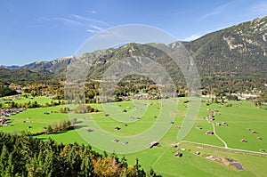 Alpine aerial view of Bavarian valley with green pastureland photo
