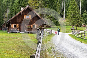 Alpine cabin and Hiker in Weisspriachtal in Lungau, Austria