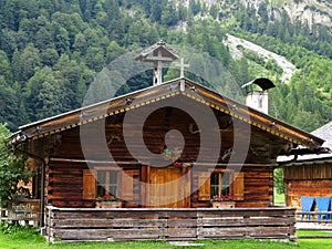 Traditional log cabin in alpine landscape