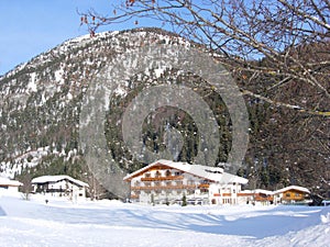 Alpine chalets with mountain backdrop