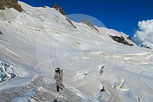 Alpine climber on mountain glacier