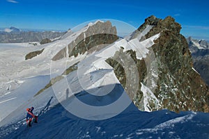 Alpine climber on mountain glacier