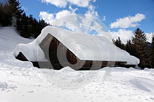 Alpine cottage in the winter