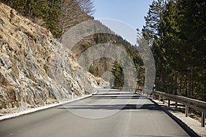 Alpine country road in the Austrian Alps - Stock Photo