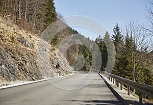 Alpine country road in the Austrian Alps - Stock Photo