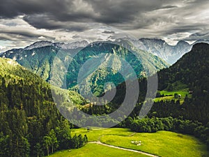 Alpine countryside landscape with high mountains. Kamnik Savinja Alps, Logar valley, Slovenia, Europe.