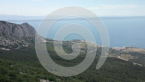 Alpine dangerous road against the backdrop of the sea coast of Croatia, location Biokovo