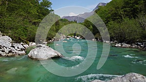 Alpine emmerald river soca in slovenian alps 4k aerial view - fresh water concept