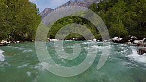 Alpine emmerald river soca in slovenian alps 4k aerial view - fresh water concept