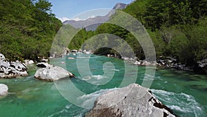 Alpine emmerald river soca in slovenian alps 4k aerial view - fresh water concept