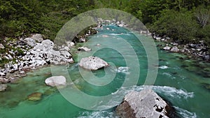 Alpine emmerald river soca in slovenian alps 4k aerial view - fresh water concept