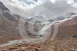 Alpine highlands. Vallelunga Glacier front in rapid retreat with moraines